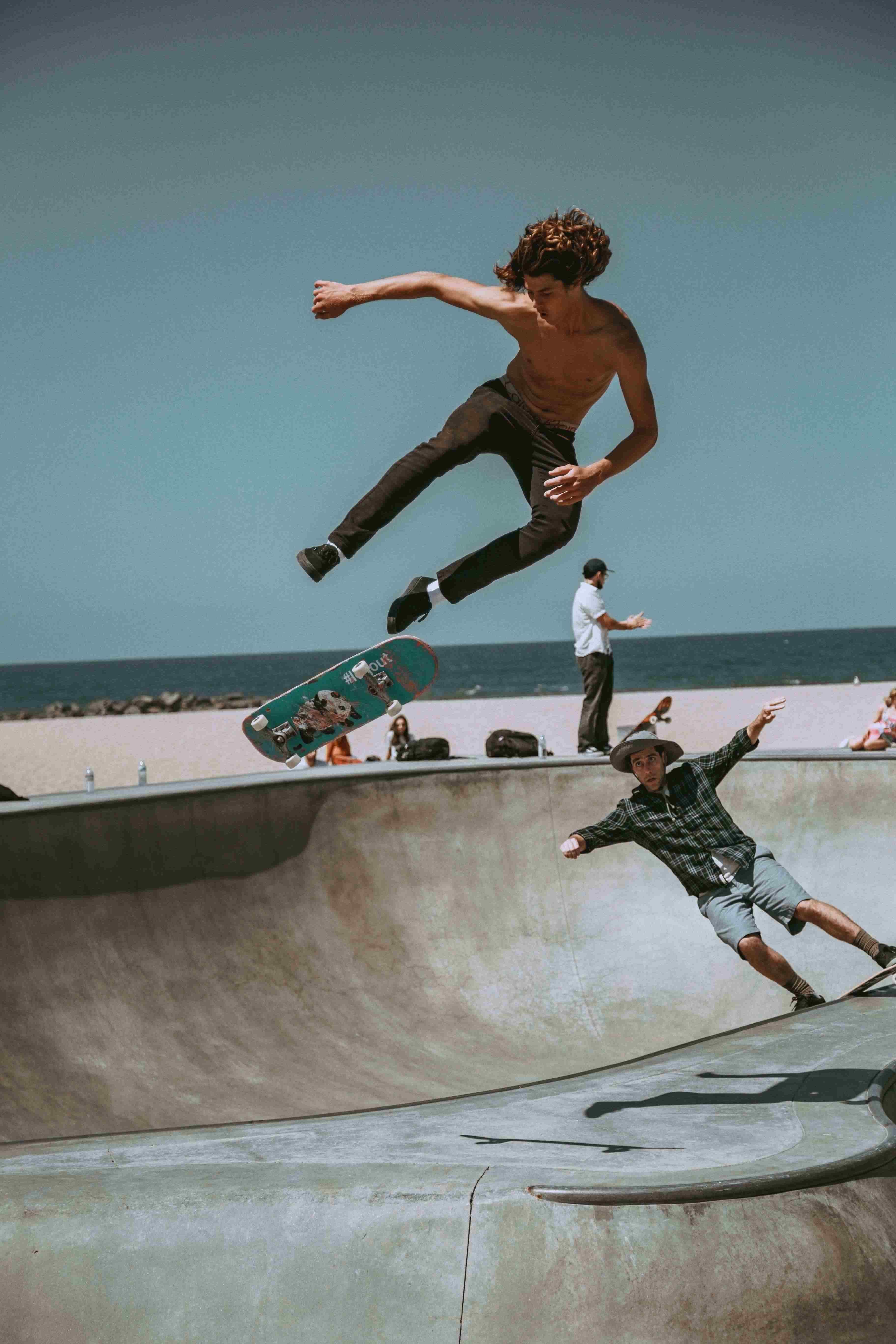 picture, men skateboarding by the beach