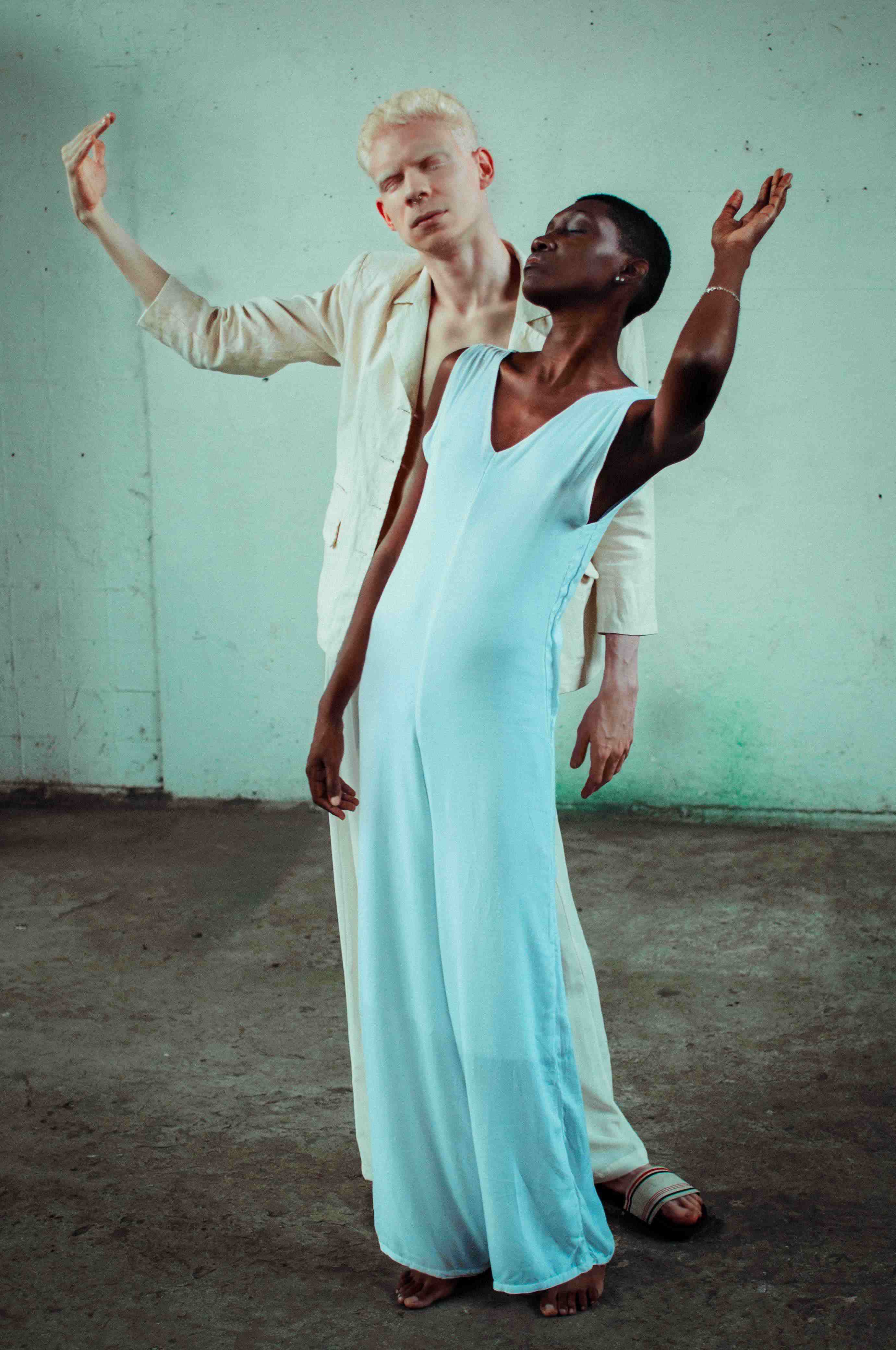 picture, woman dressed in blue and man dressed in white dancing